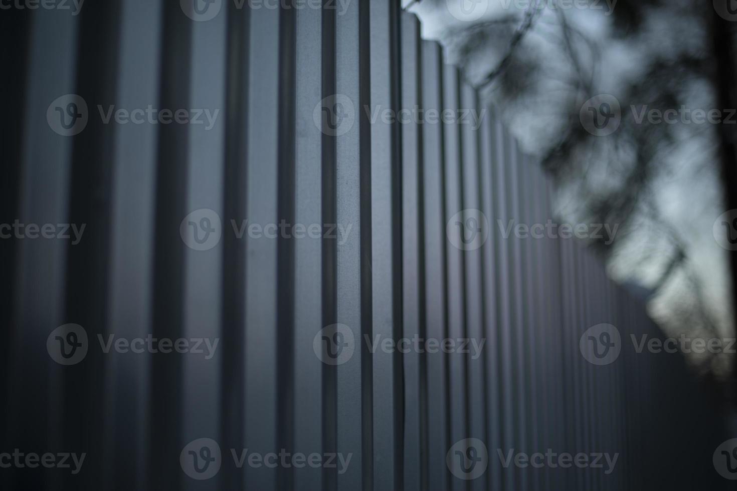 Steel fence. Fence is in detail. Metal profile sheet. photo