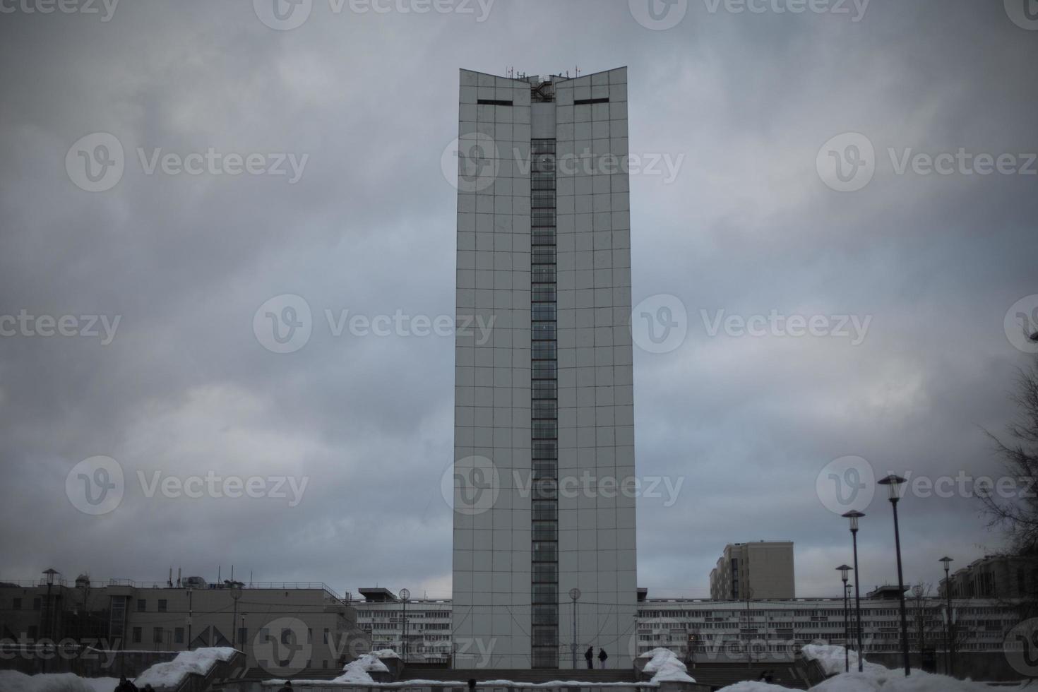 View of city. Tall building. City is in winter. photo
