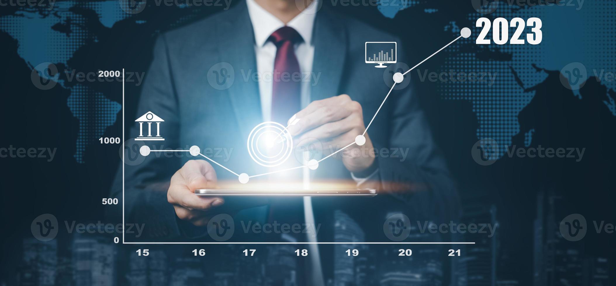 Business growth data chart arrow with diagram 2023 budget, Businessman pointing arrow graph corporate future growth year 2022 to 2023, Development to success and motivation. photo
