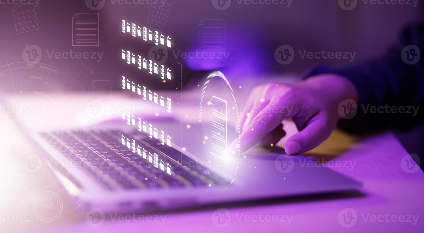 Businessman working on laptop with virtual screen. Online documentation database, IT consultant being set up Virtual Document Management System with laptop,Software for archiving corporate files. photo