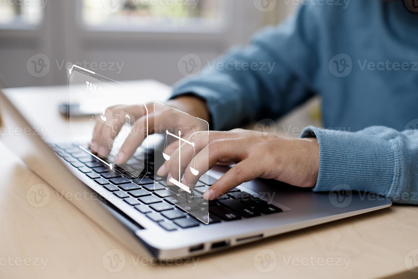 Hand using tablet with bar  TAX REFUND and refund tax of duty taxation business, graphs and chart being demonstrated on the screen media,  tablet pc and selecting tax refund. photo