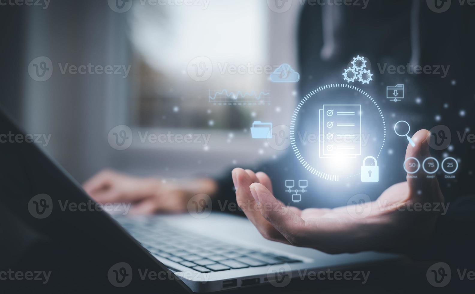 Businessman working on laptop with virtual screen. Online documentation database, IT consultant being set up Virtual Document Management System with laptop,Software for archiving corporate files. photo