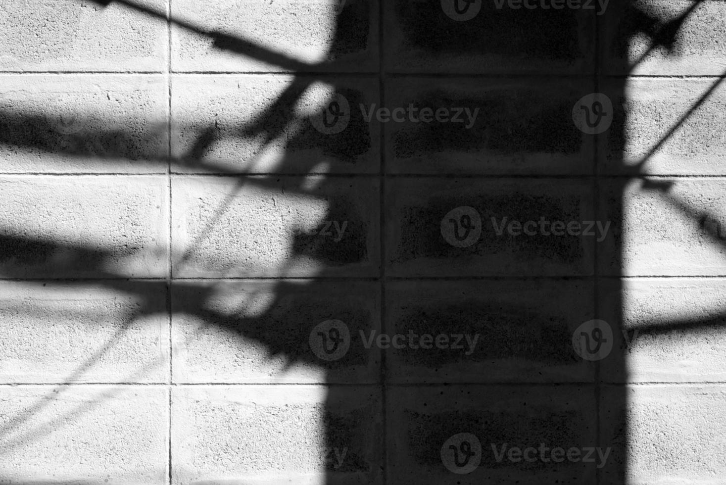 High Voltage Pole Shadow on Concrete Wall. photo