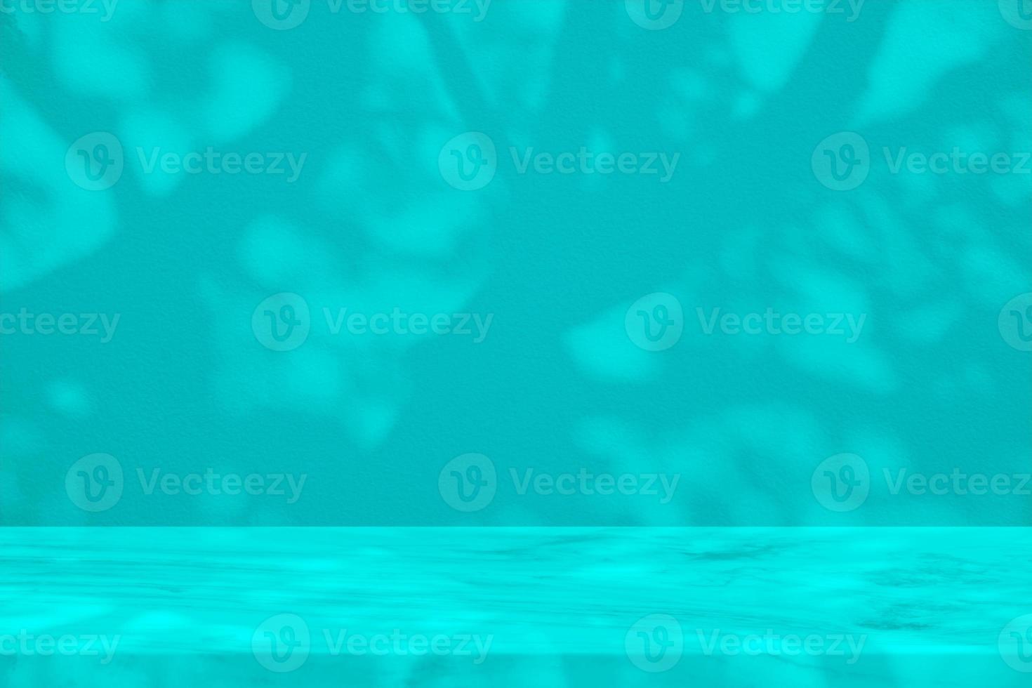White Marble Table with Tree Shadow on Concrete Wall Texture Background in Dark Turquoise Color, Suitable for Product Presentation Backdrop, Display, and Mock up. photo