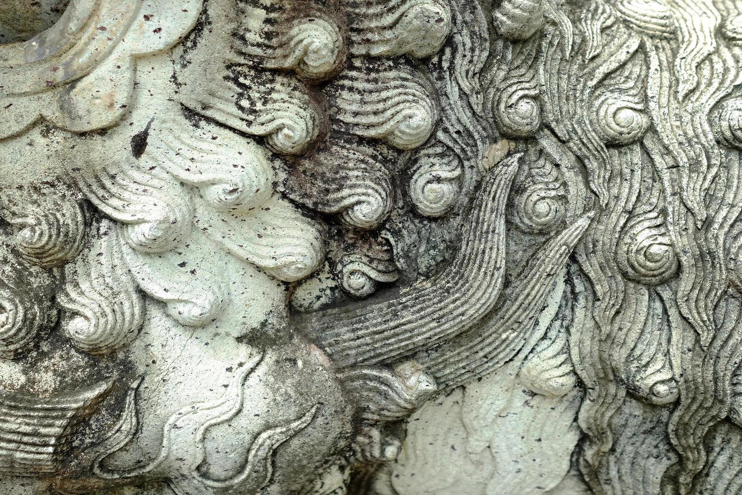 Close up Ancient Chinese Lion Statue. photo