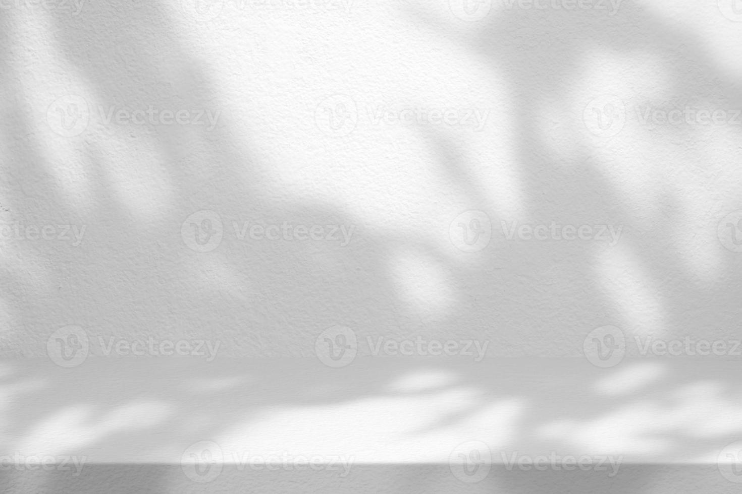 White Stucco Table with Tree Shadow on Concrete Wall Texture Background, Suitable for Product Presentation Backdrop, Display, and Mock up. photo