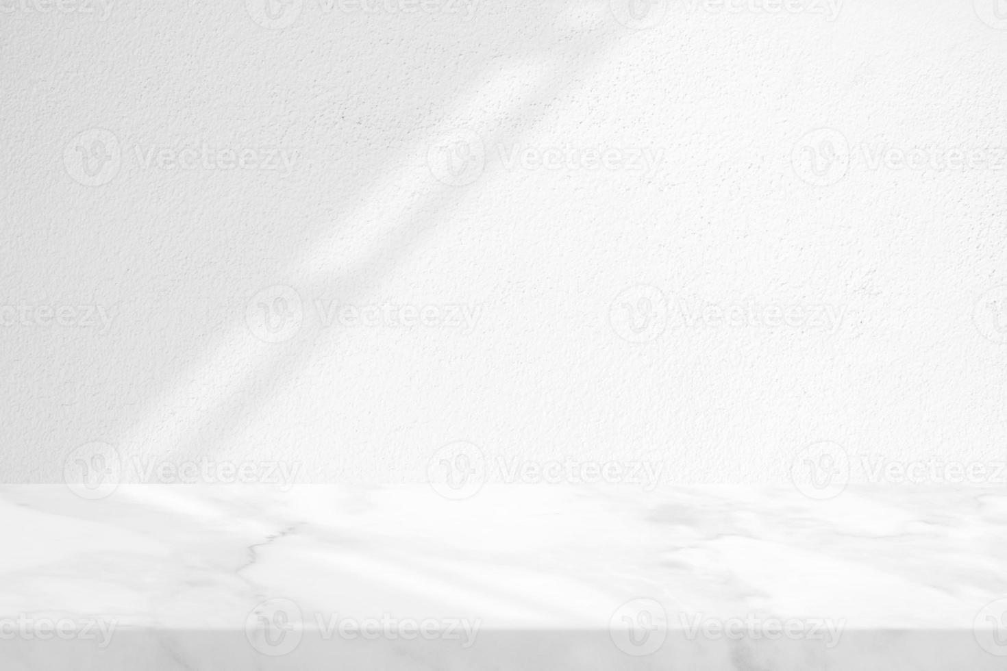 Marble Table with White Stucco Wall Texture Background with Light Beam and Shadow of Roof, Suitable for Product Presentation Backdrop, Display, and Mock up. photo
