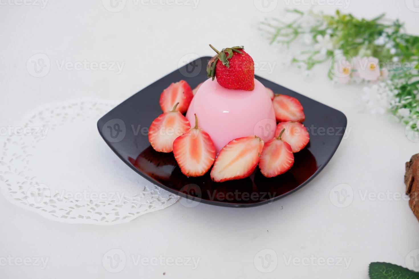 Pudding with delicious strawberries as a background photo