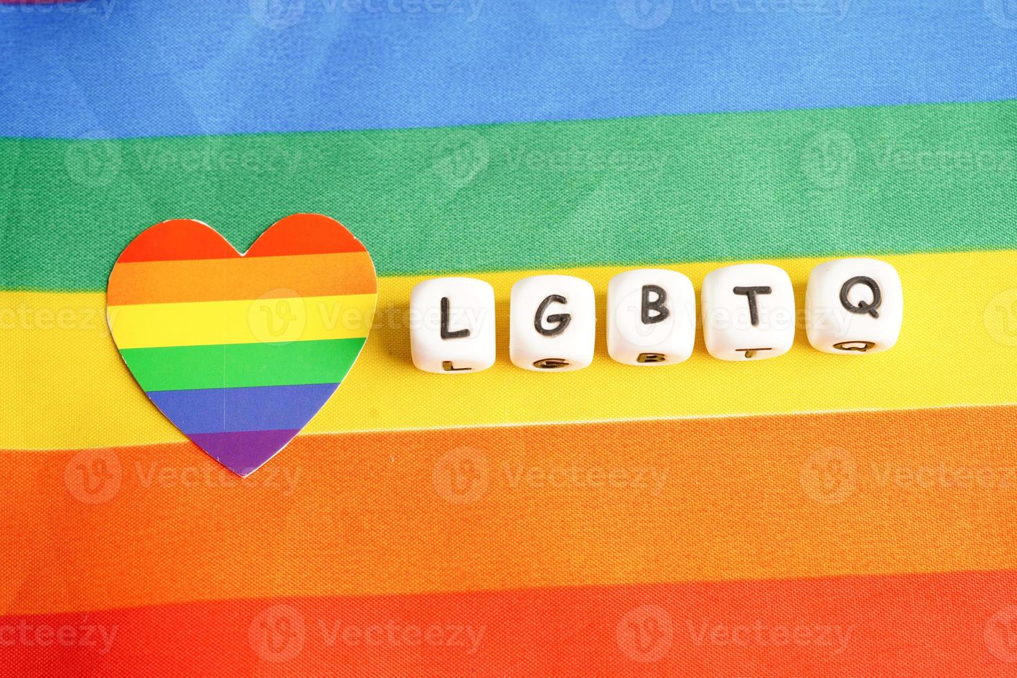 LGBT text character with rainbow flag heart for symbol of pride month lesbian, gay, bisexual, transgender, human rights, tolerance and peace. photo