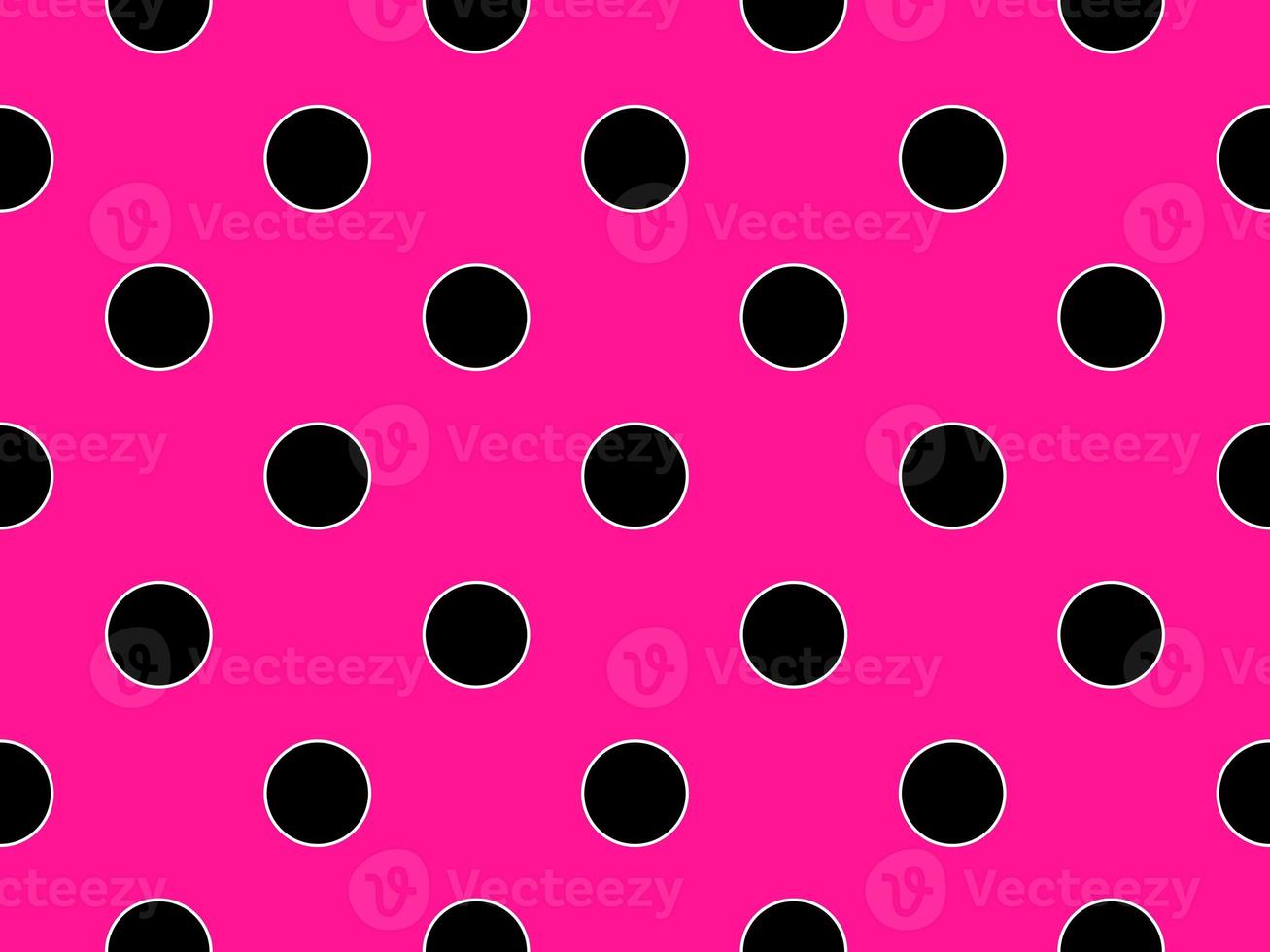 black color polka dots over deep pink background photo