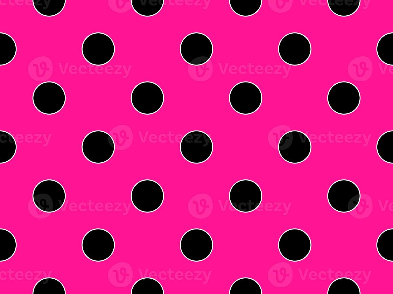 black color polka dots over deep pink background photo