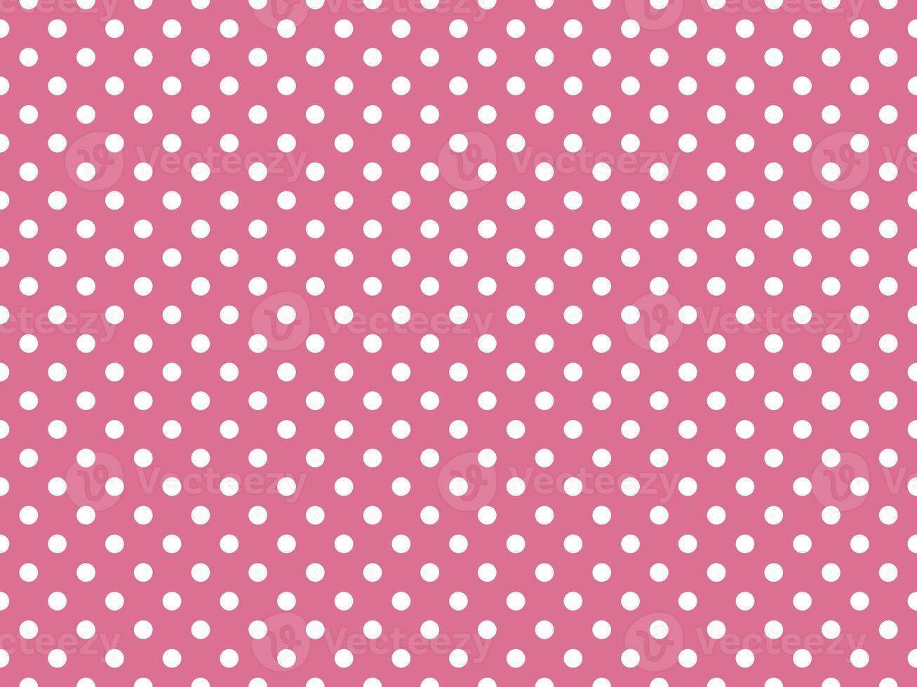 white polka dots over pale violet red background photo