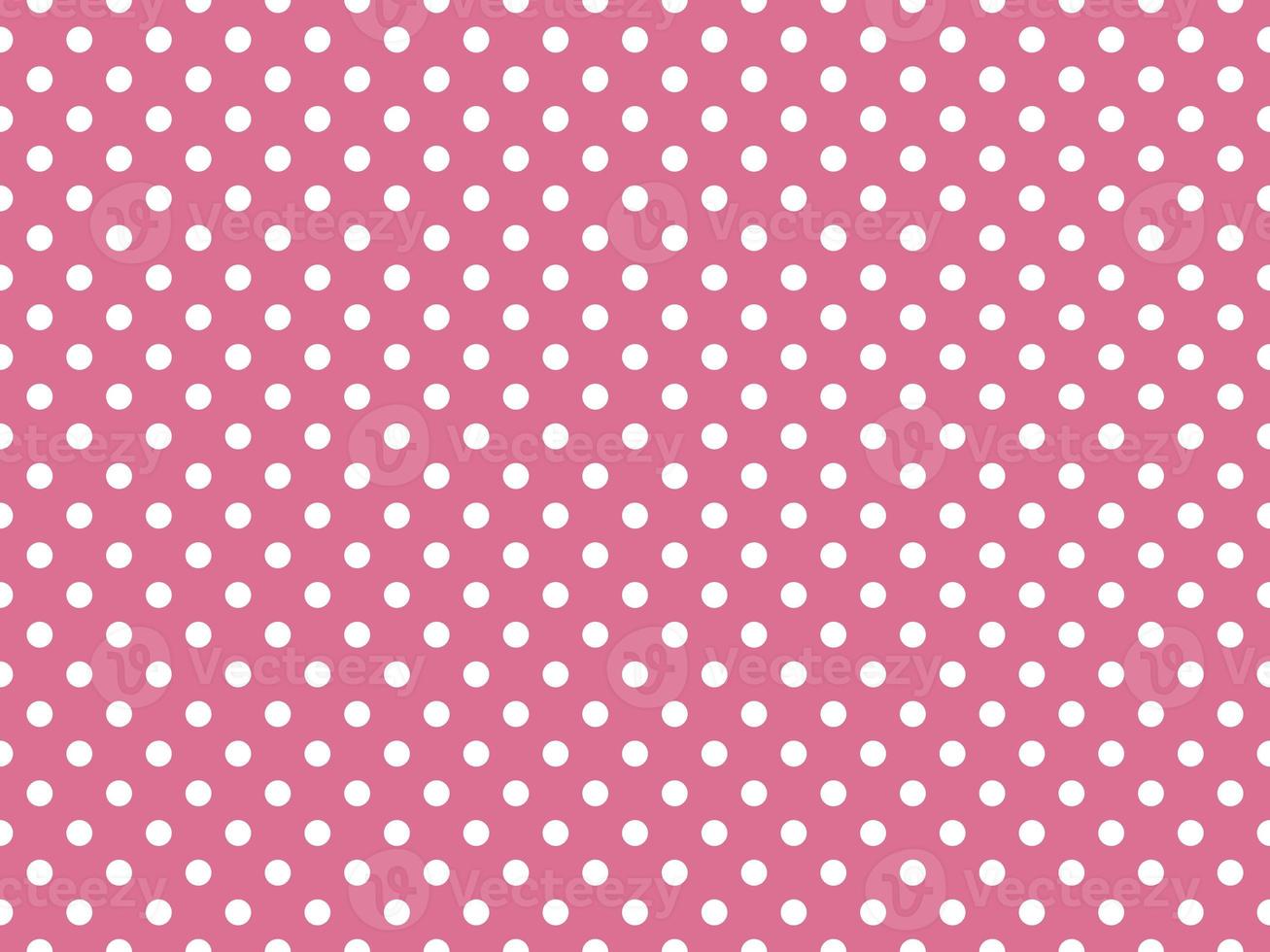 white polka dots over pale violet red background photo