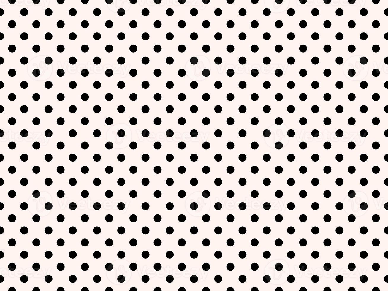 black polka dots over sea shell background photo