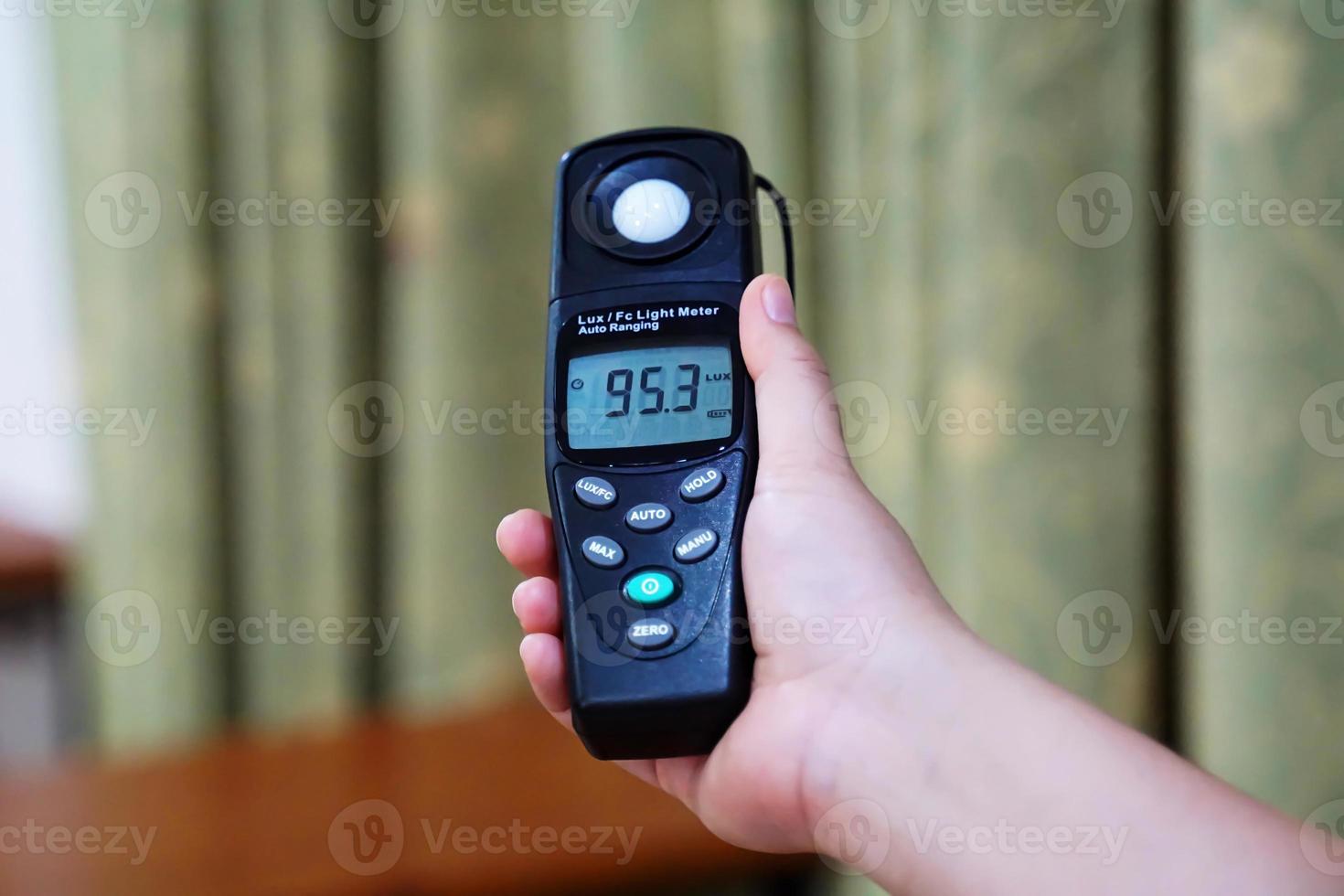 Light meter, Lux Light Meter hold in hand to measure the brightness of work light and every environment. soft and selective focus. photo