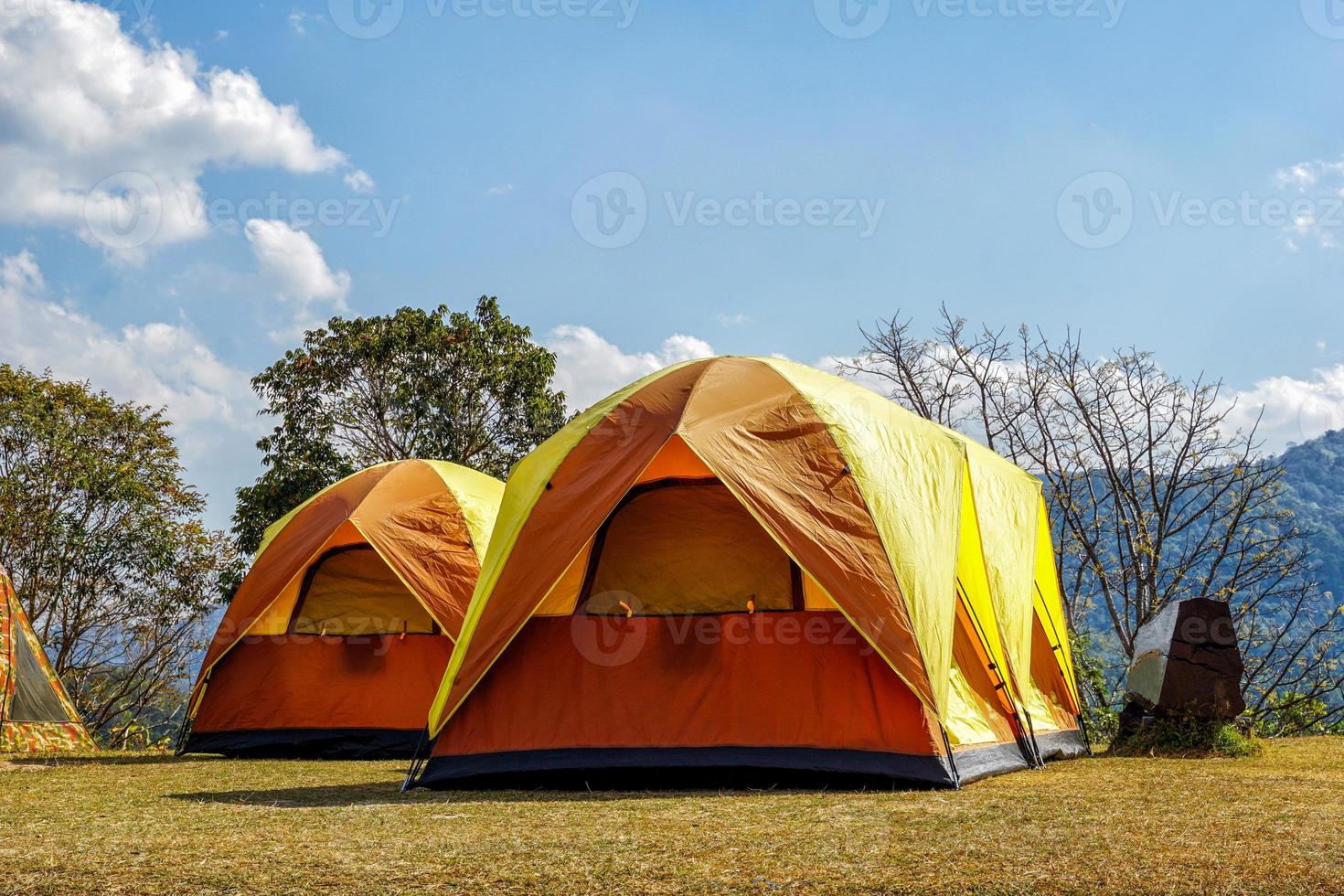camping tent on the top of the mountain in winter in northern Thailand, view of trees, sky and clouds in clear air. Soft and selective focus. photo