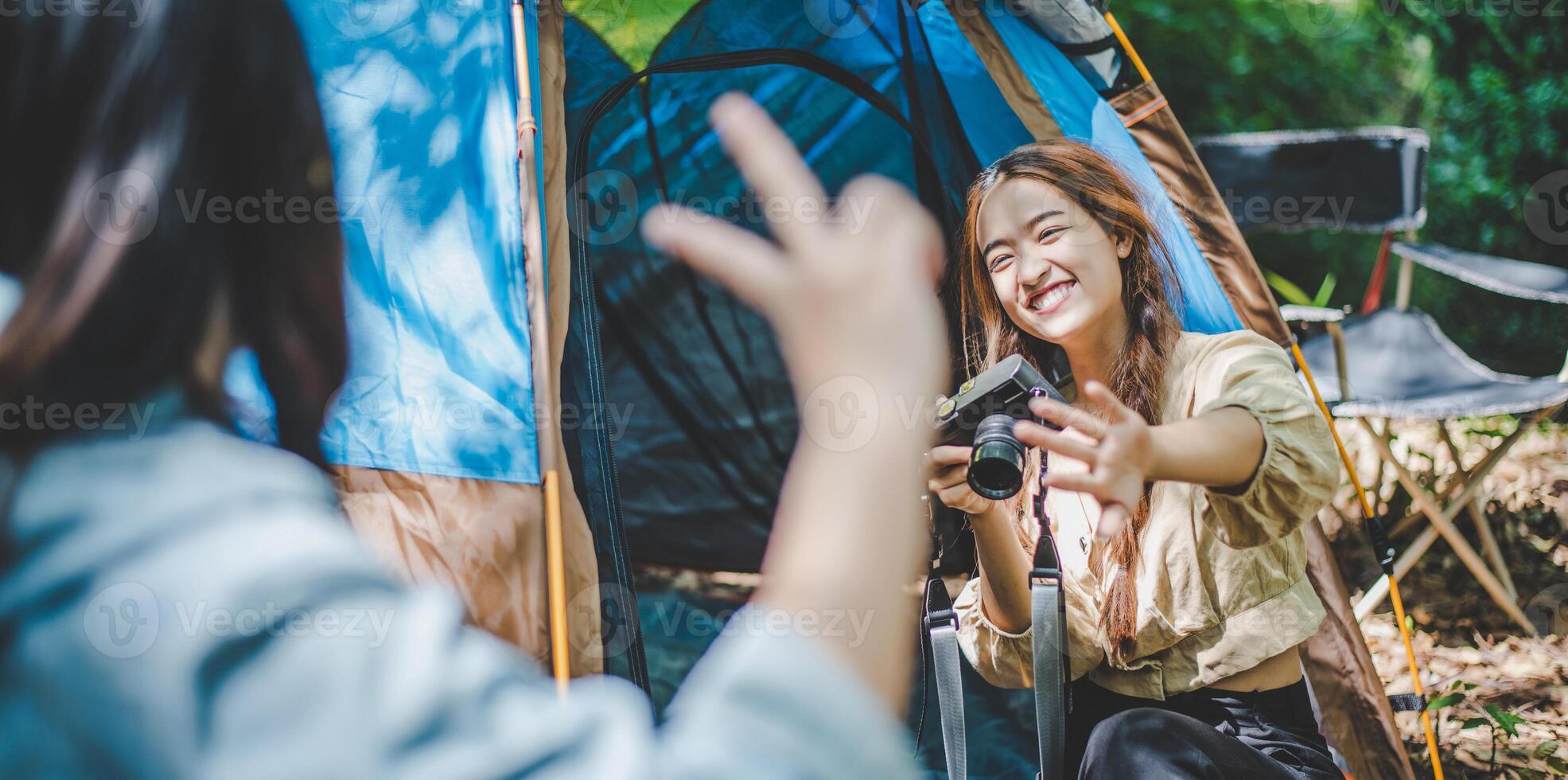 Young woman use camera taking photo and show her friends