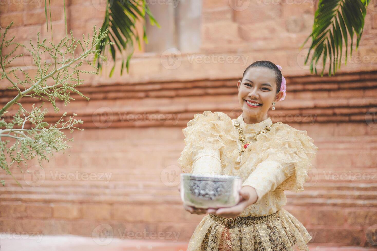 Portrait beautiful woman in Songkran festival with Thai Traditional costume photo