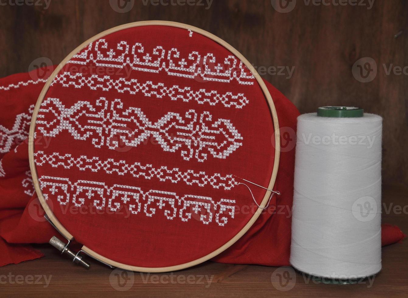 Red fabric with embroidery pattern photo