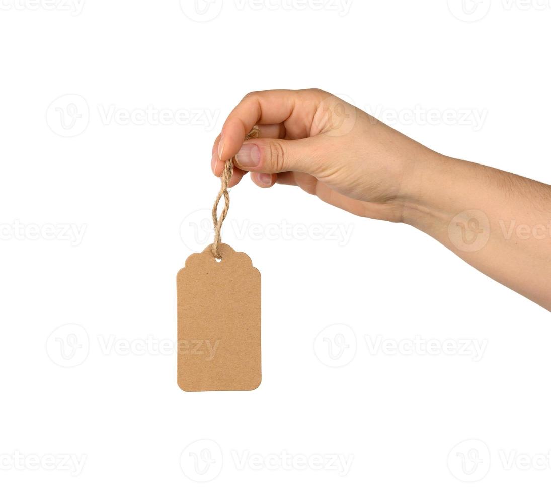 blank brown rectangular brown paper tag on a rope isolated on white background photo