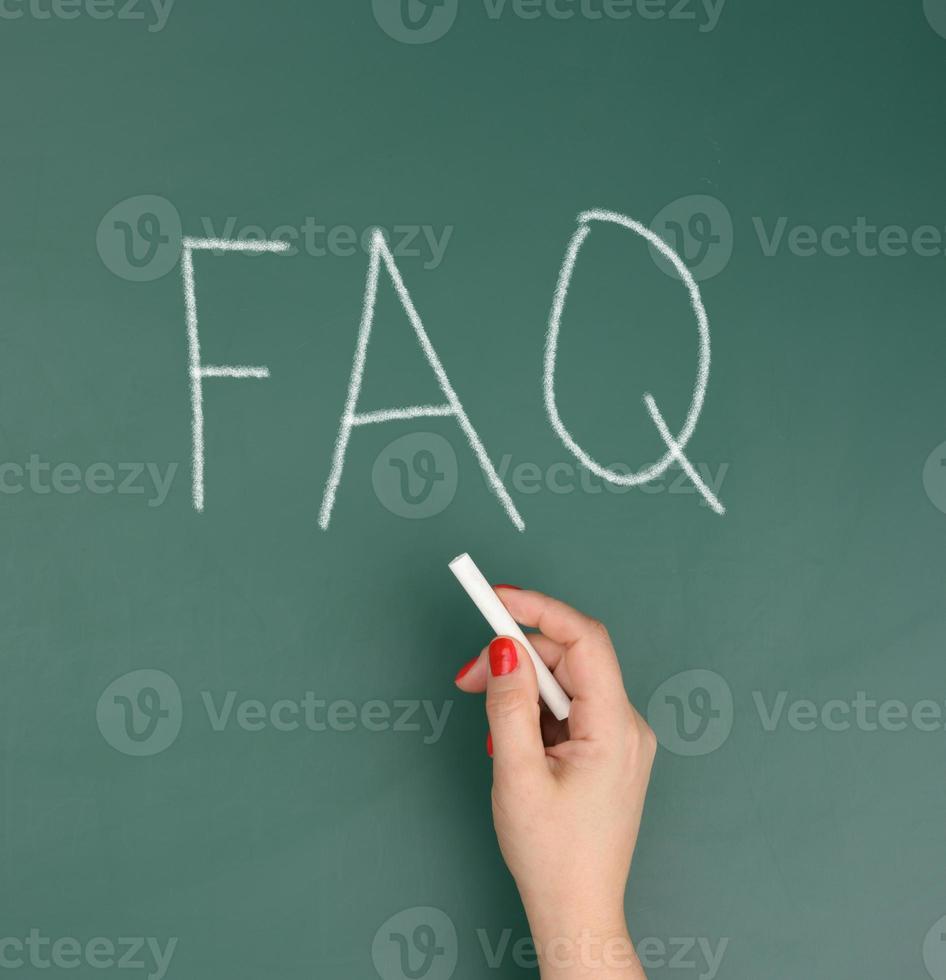 inscription FAQ frequently asked questions on a green background photo