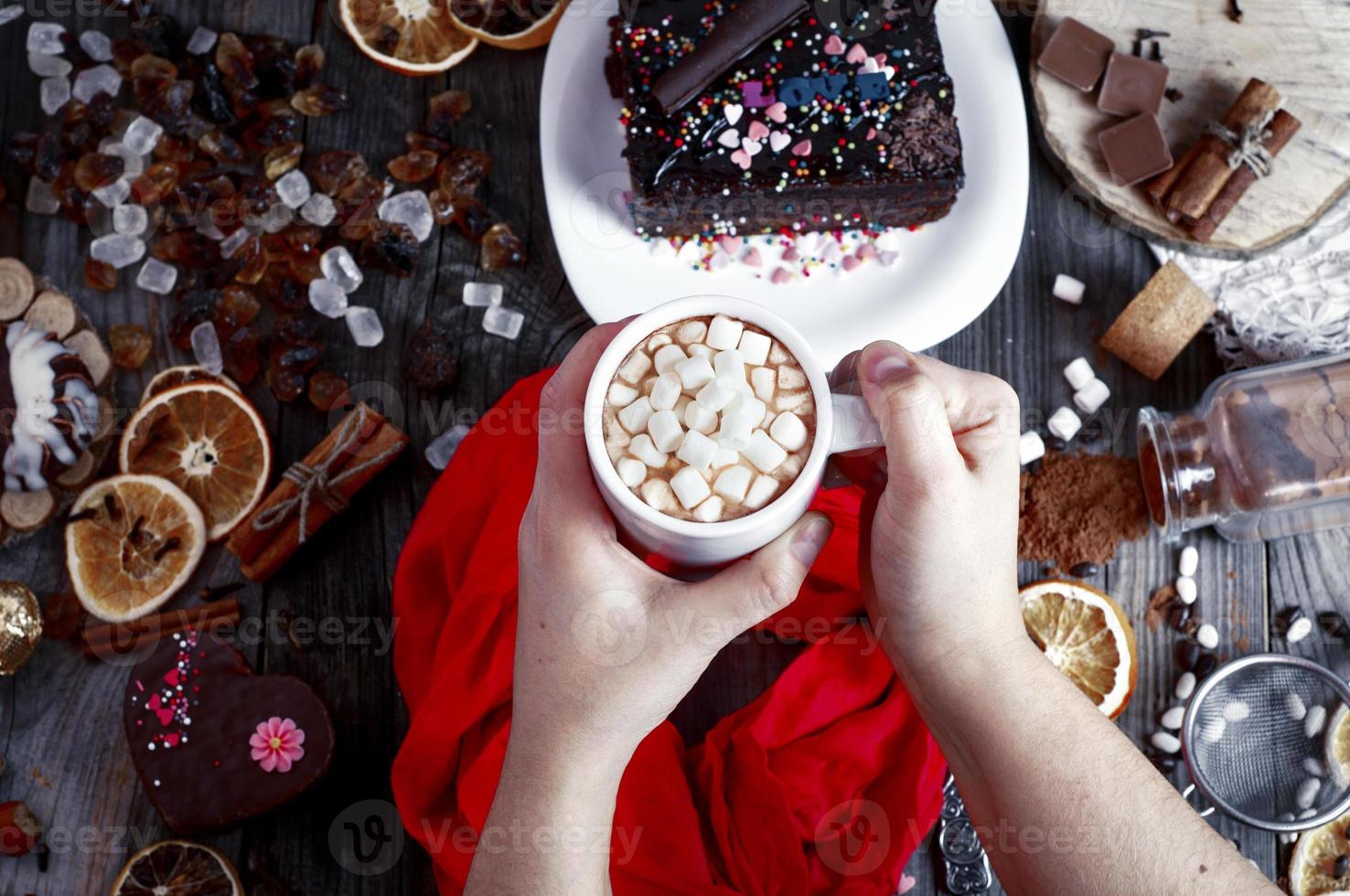 female hands holding a cup with a drink photo