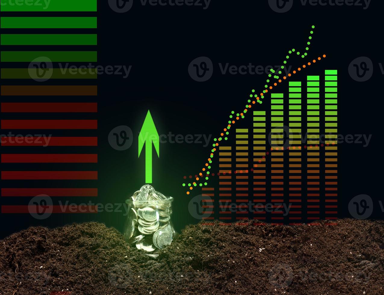 a can of coins on the ground and a growing graph of indicators. Performance growth concept photo