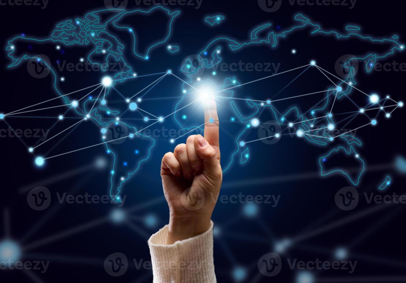 female hand presses on the connection point and holographic global network with connections. Internet communications, wireless connection, distribution point photo
