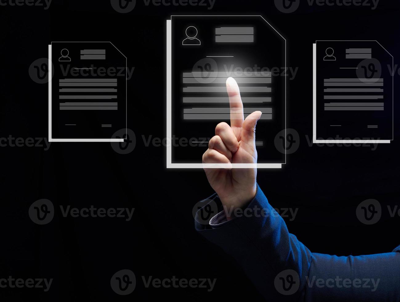 a female hand selects a candidate's resume on a virtual screen. The concept of finding employees, career advancement photo
