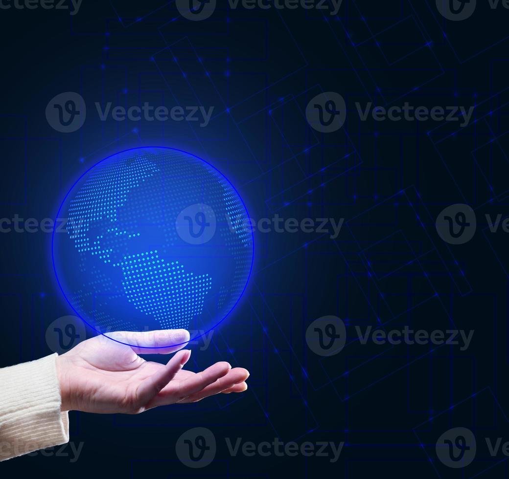 hand holds a holographic globe model. The concept of global internet coverage of the globe. Quick exchange of information photo