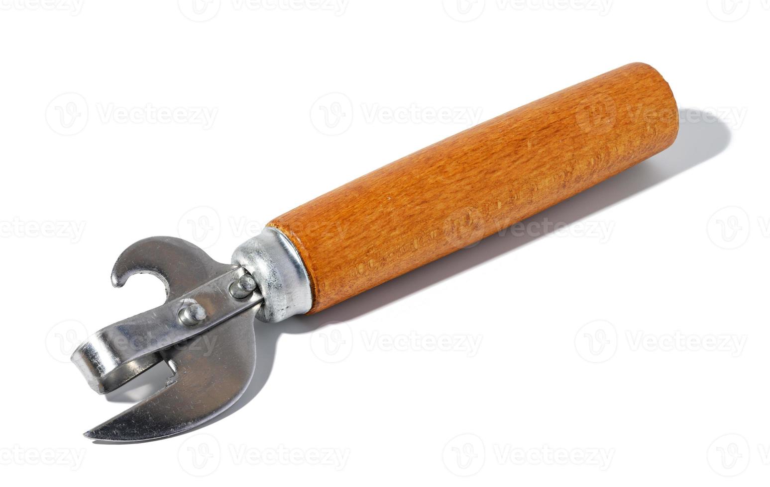 Hand opener for cans, bottles with a wooden handle on a white isolated background photo