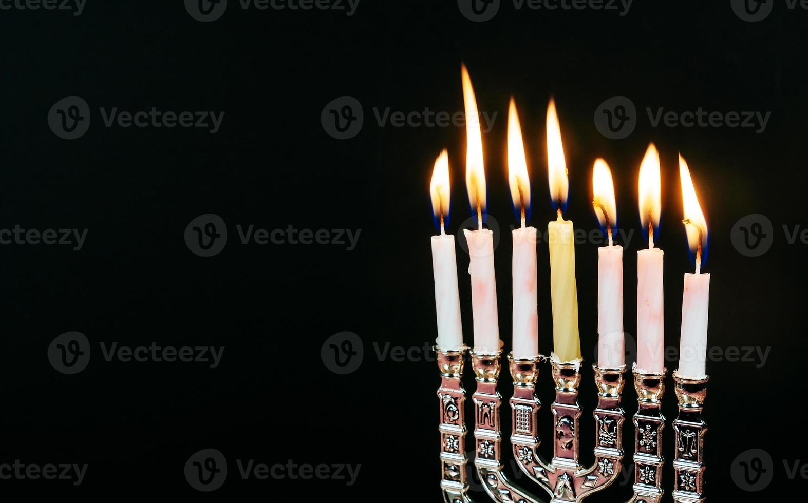 Jewish holiday Hanukkah creative background with menorah. View from above focus on . photo