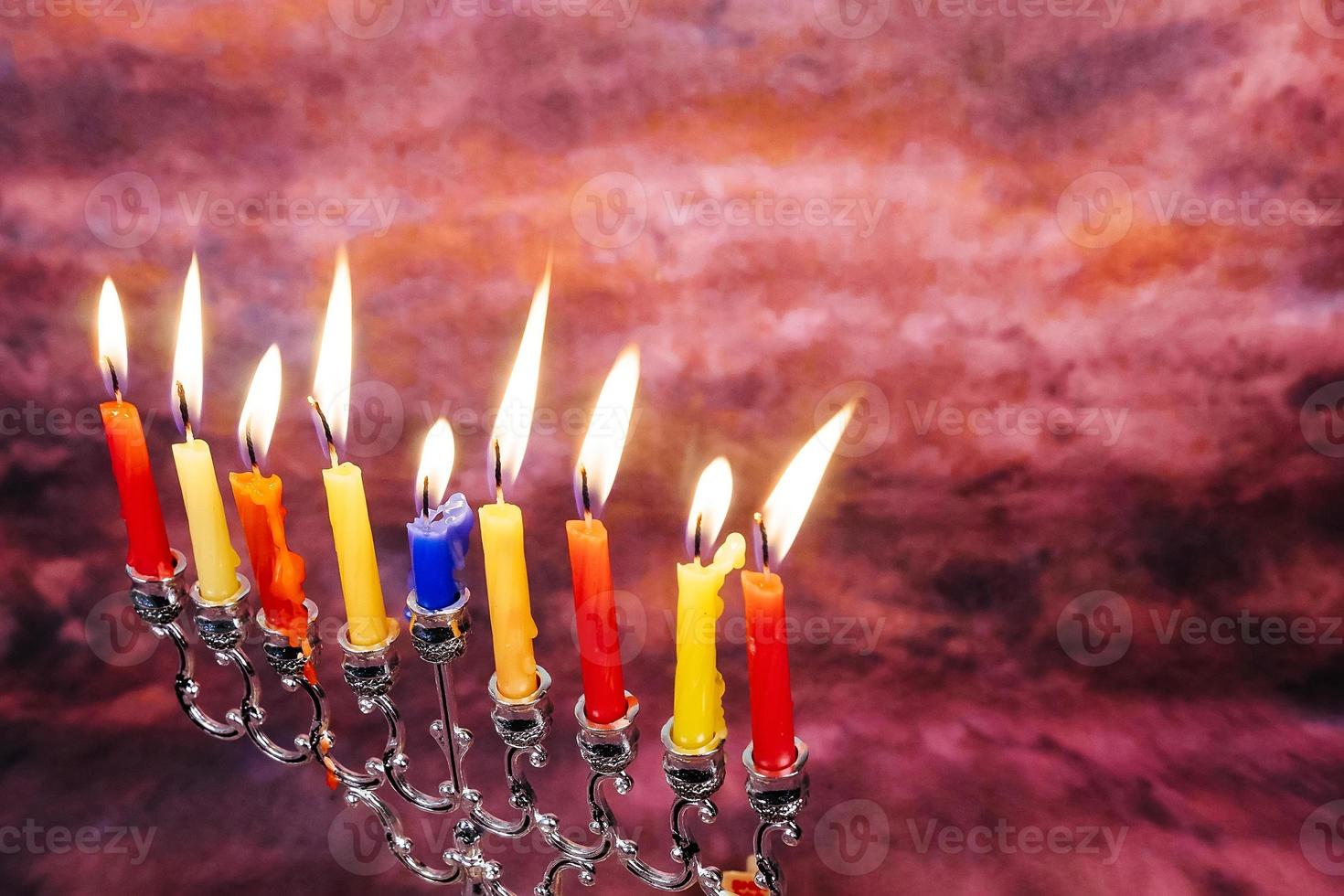 Jewish holiday Hanukkah creative background with menorah. View from above focus on . photo