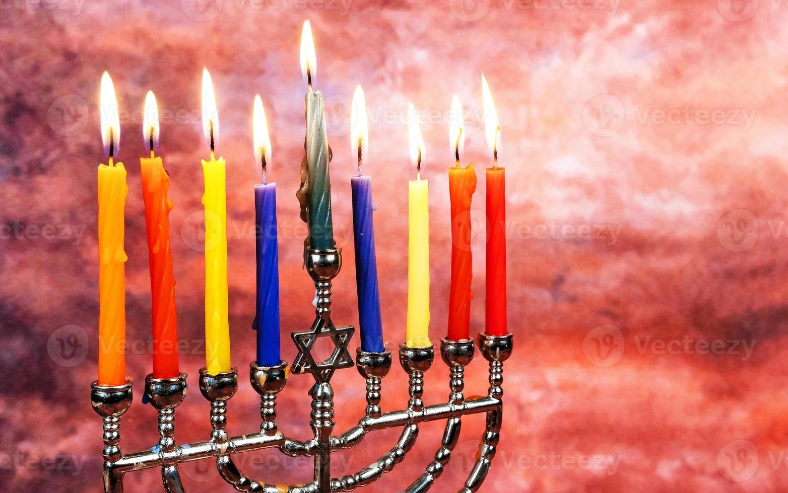 Jewish holiday Hanukkah creative background with menorah. View from above focus on . photo