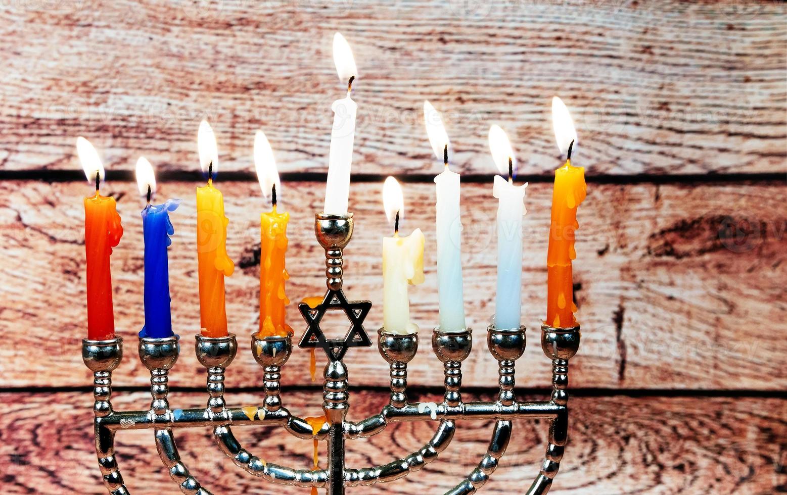 Jewish holiday Hanukkah creative background with menorah. View from above focus on . photo