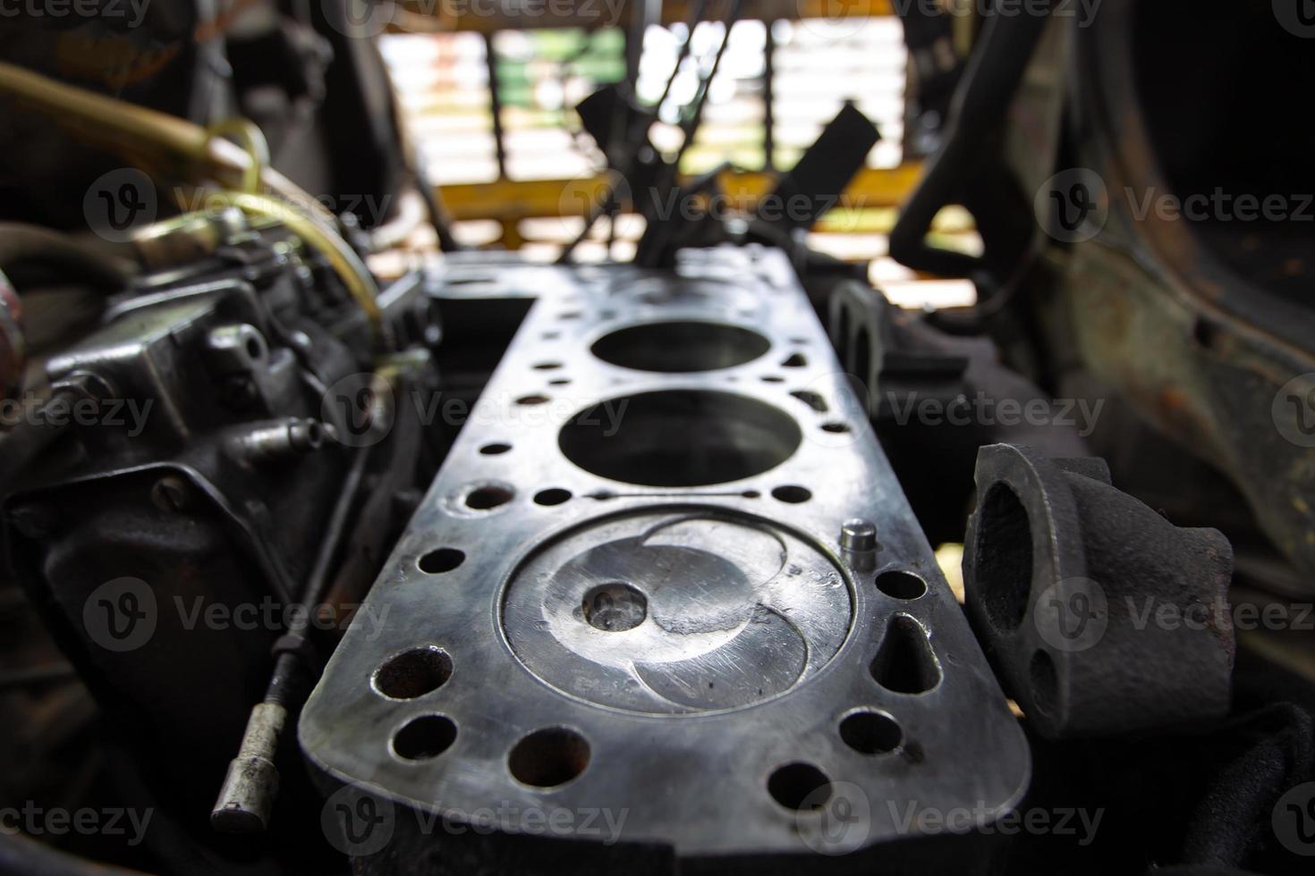 Mercedes diesel engine repair. Hands with a mechanic repairing Mercedes parts. Piston group with cylinder block. photo