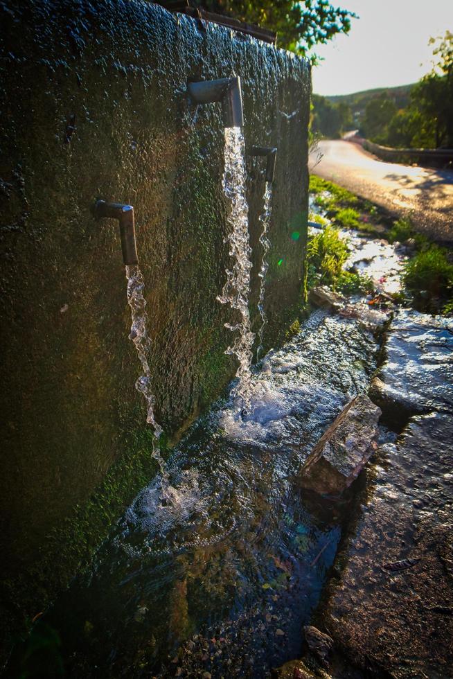 fresh water along road photo