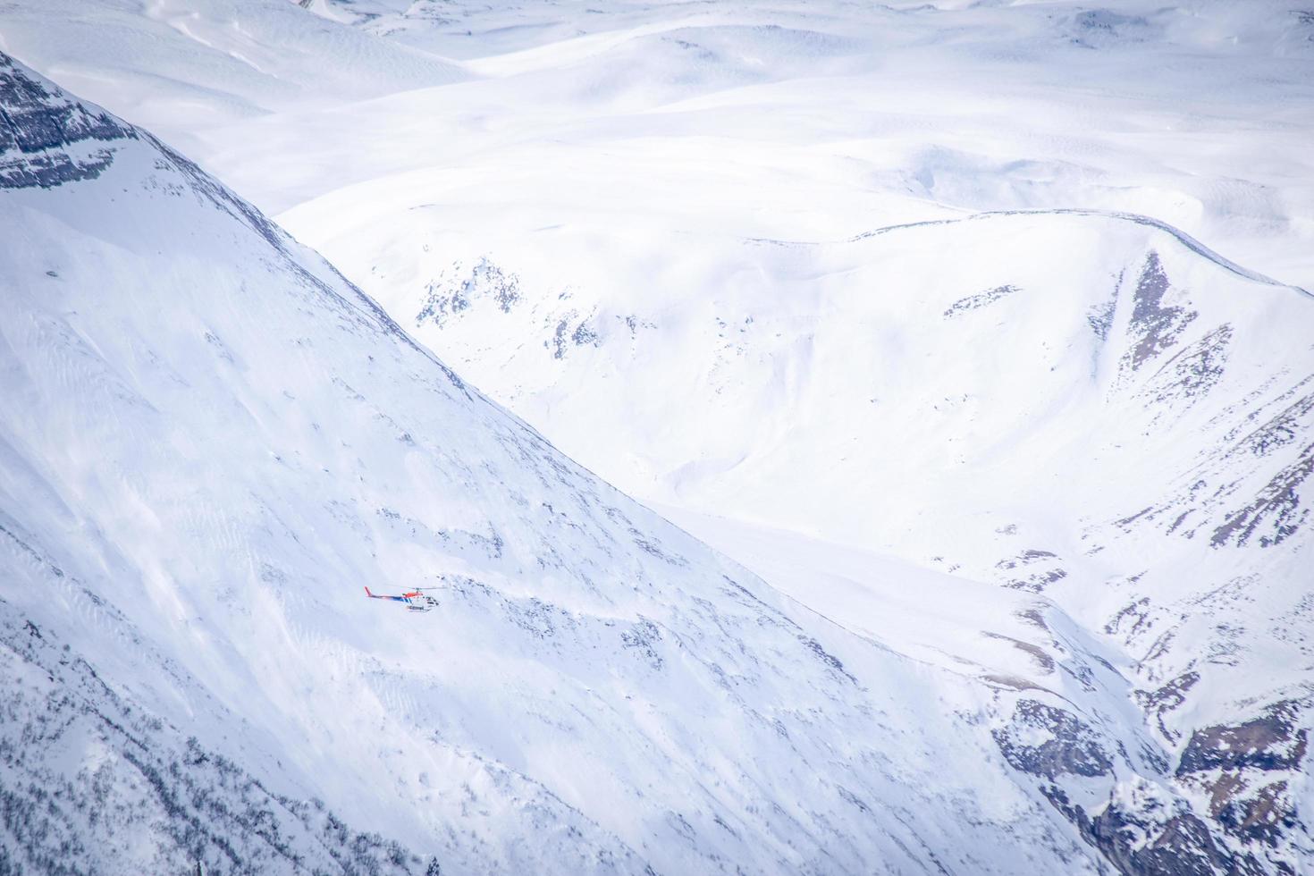 helicopter in mountains photo