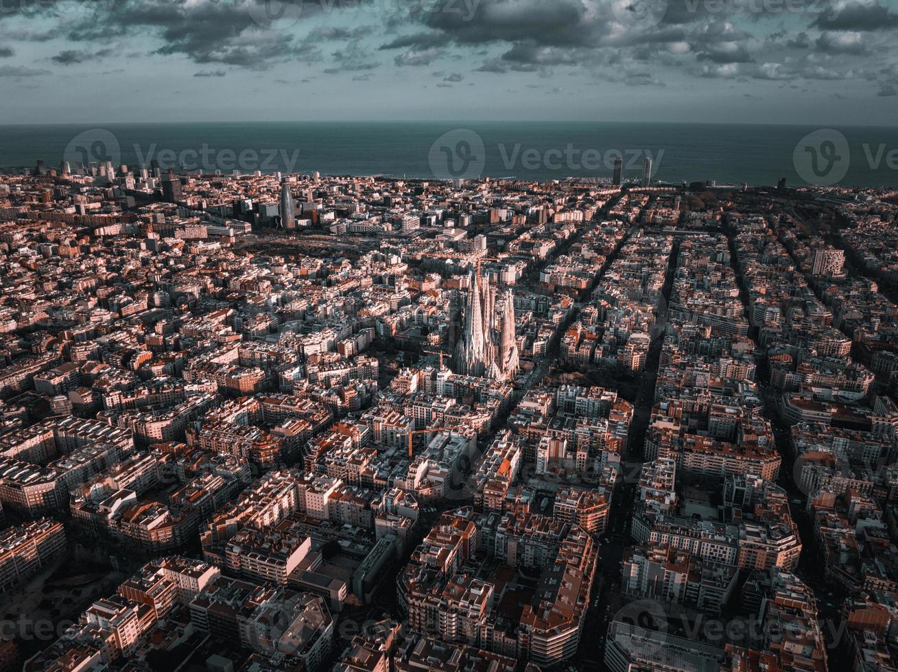 Aerial view of Barcelona City Skyline and Sagrada Familia Cathedral at sunset. photo