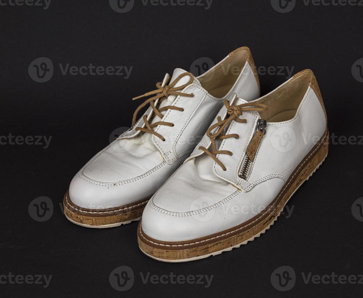 White shoes with cork soles and brown laces. many parts with different angles. new1 photo