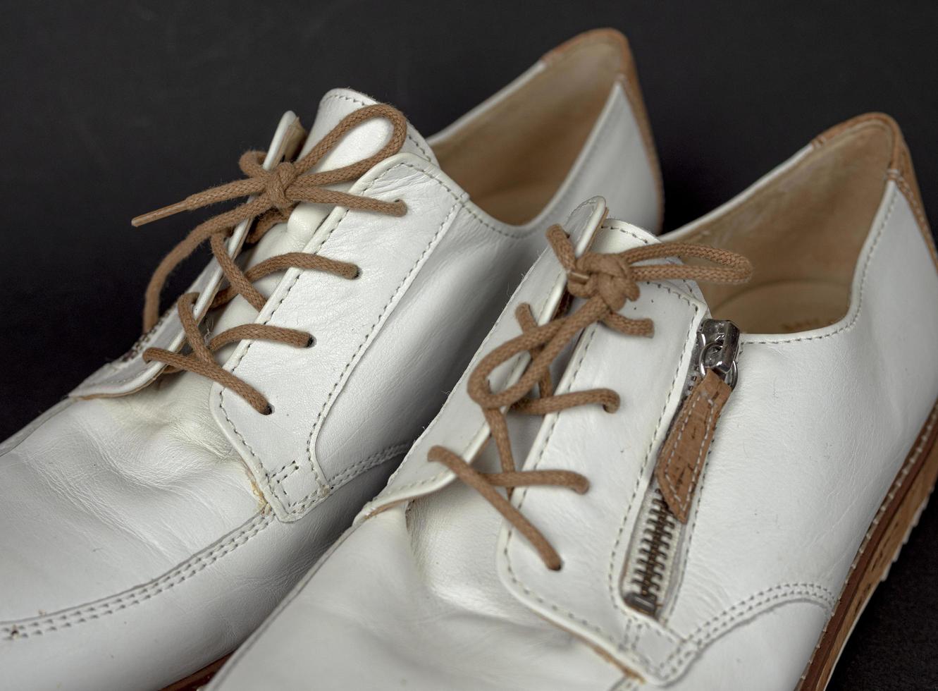 White shoes with cork soles and brown laces. many parts with different angles. part2 photo