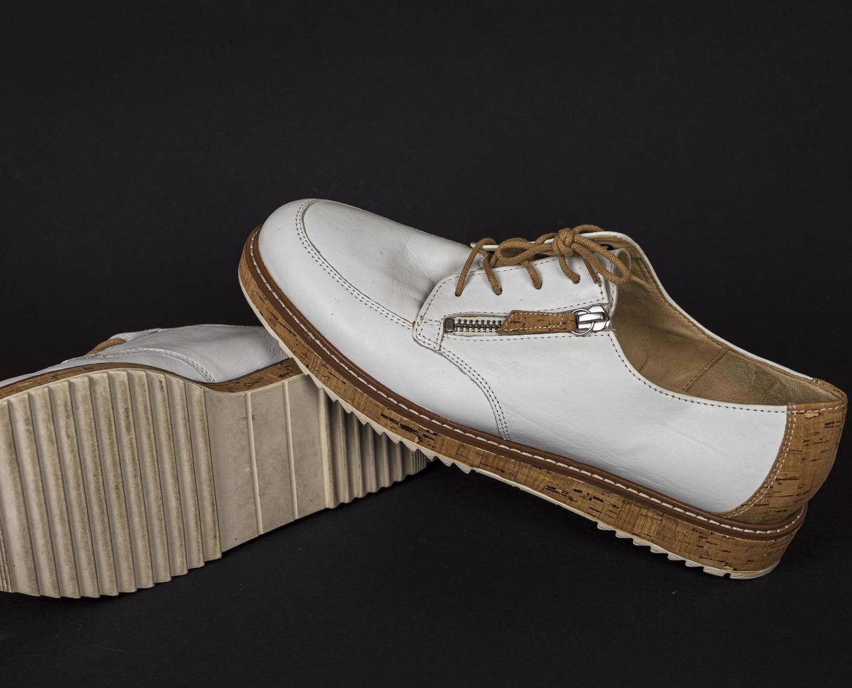 White shoes with cork soles and brown laces. many parts with different angles. part3 photo