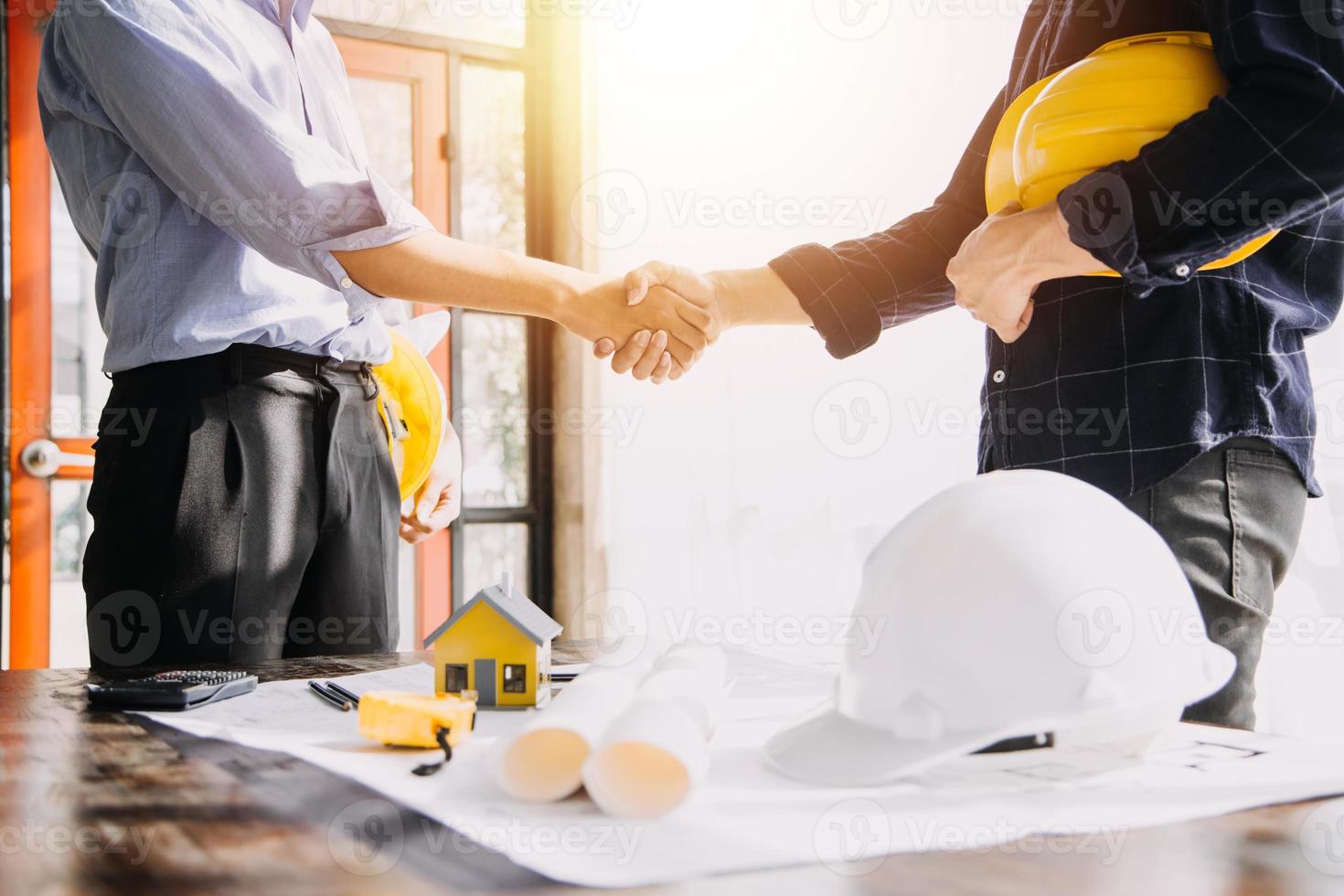 Architect concept, Architects working with blueprints in the office, Vintage Effect photo
