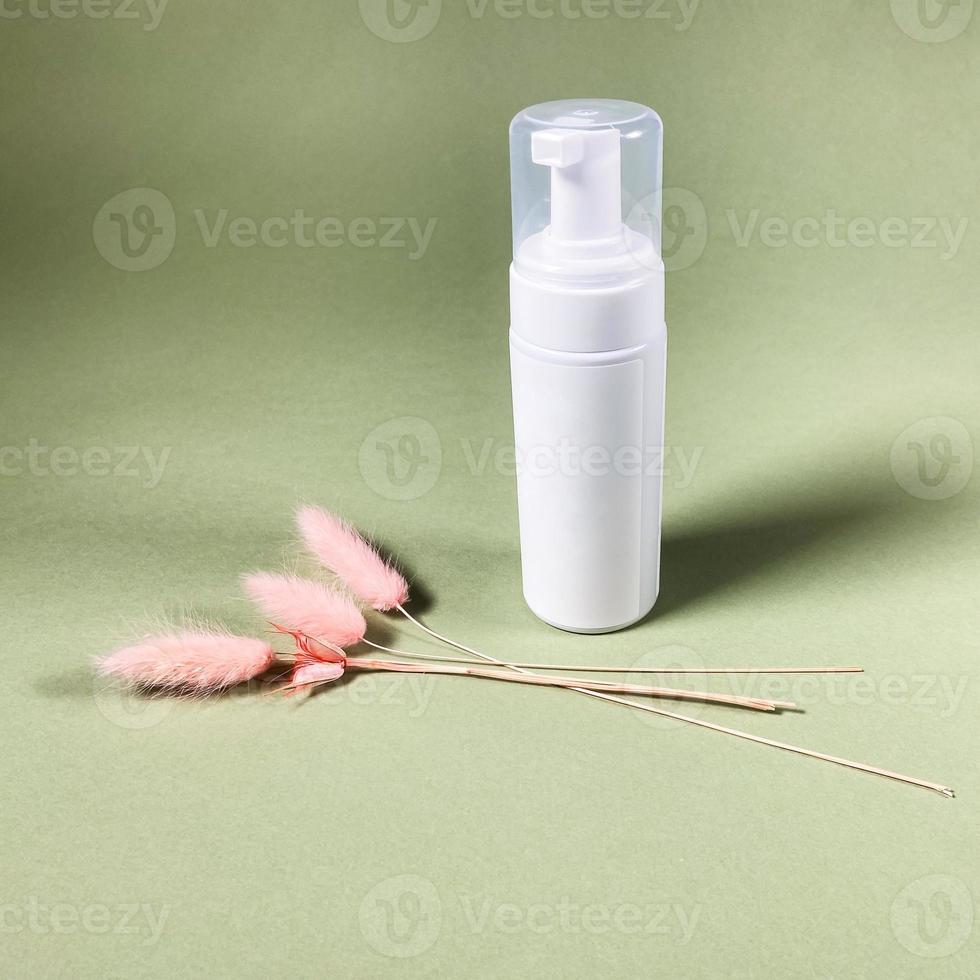 closed white blank pump plastic bottle on khaki photo