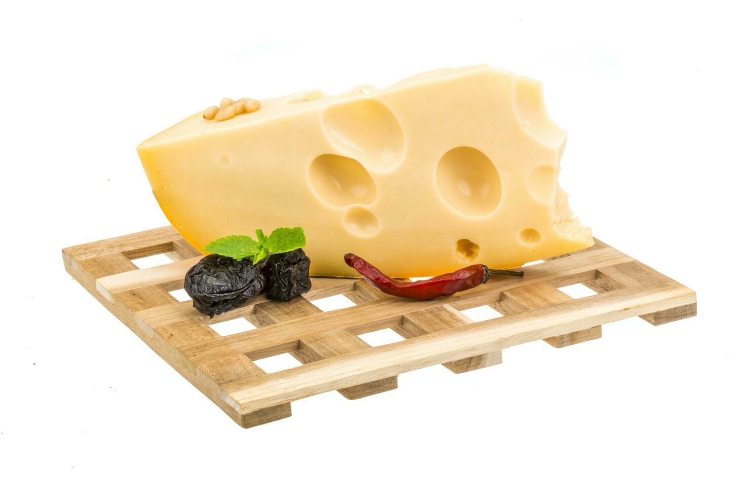 Maasdam cheese on wooden board and white background photo
