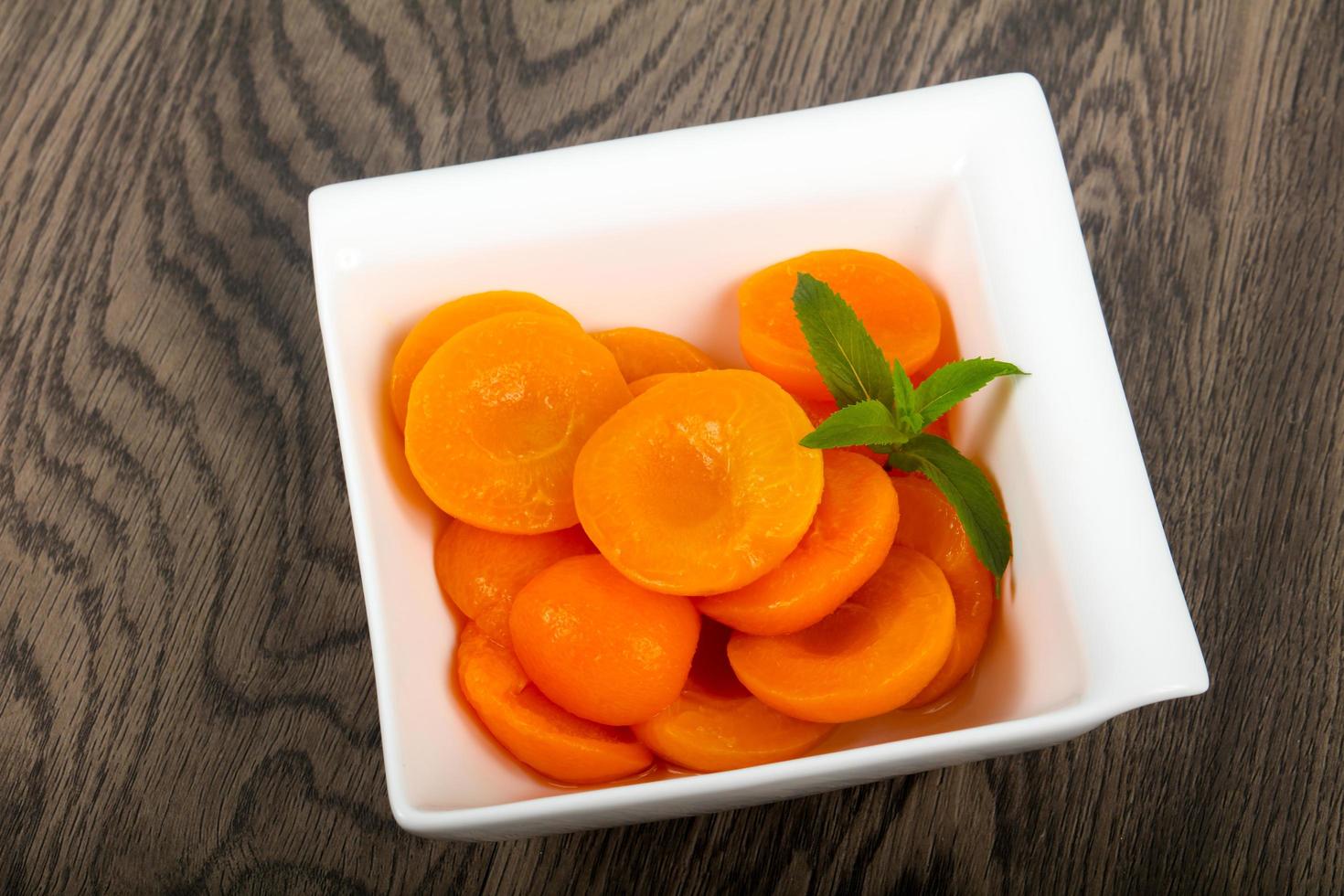 Canned apricots dish view 19853279 Stock Photo at Vecteezy