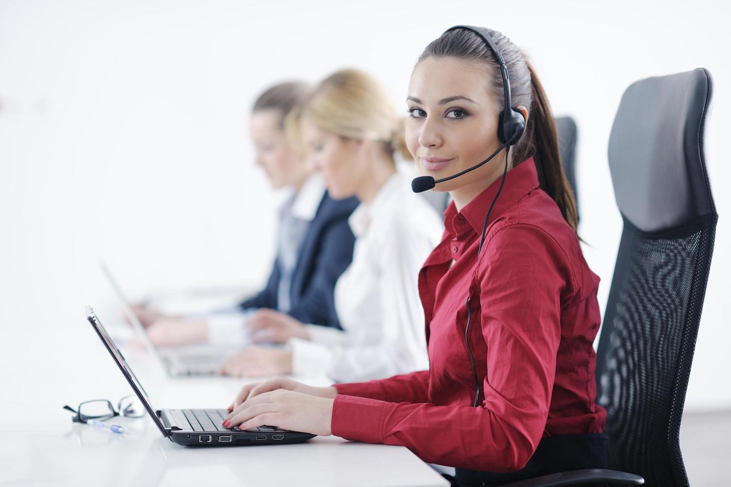 business woman group with headphones photo