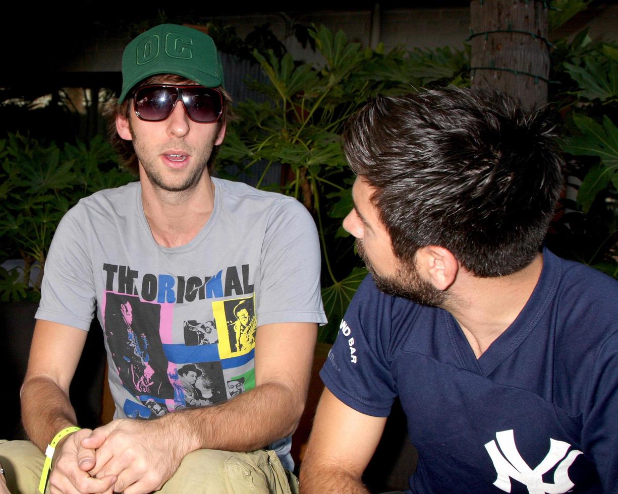 Joel David Moore and Joshua Gomez Chuck Kickoff party presented by Guitar Hero Five Roosevelt Hotel Pool Los Angeles, CA October 10, 2009 photo