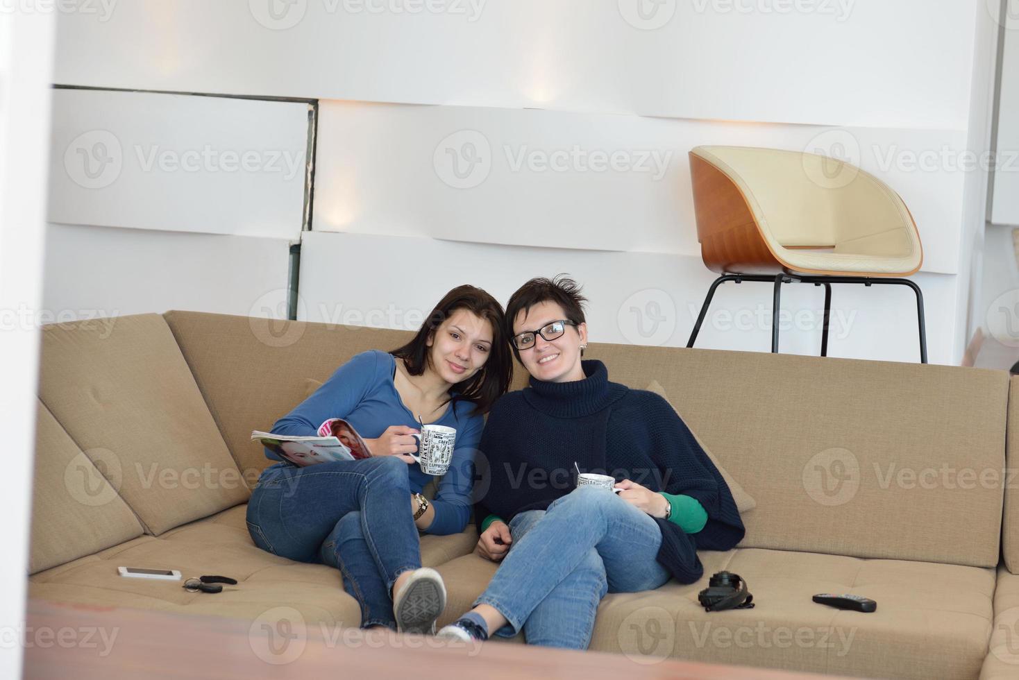 friends with coffee cups enjoying a conversation photo