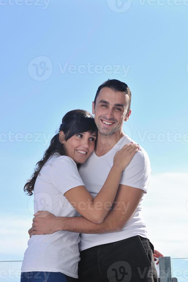 couple relaxing on balcony photo